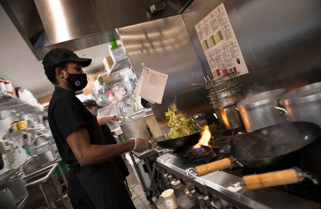 Chef Zeek Williams of Lindenwold cooks in the kitchen of Teriyaki Madness in Marlton. 