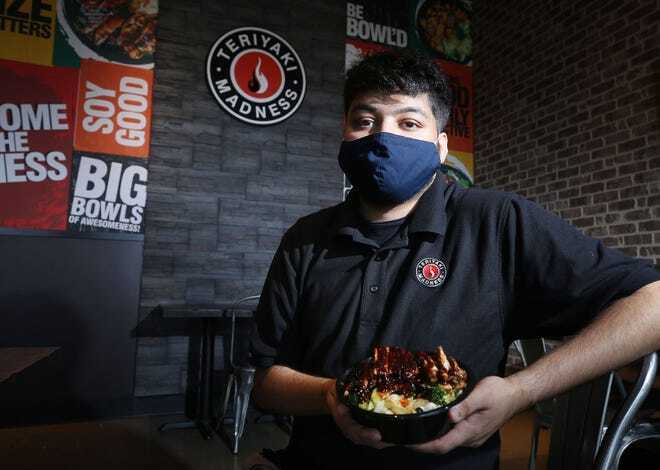 Smit Patel, who co-owns Teriyaki Madness, 833 Polaris Parkway in Westerville, with his brother Dhruv Patel, displays a teriyaki chicken entree that's on the menu at the new restaurant.